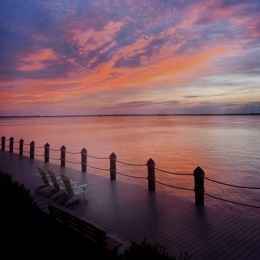 a sunset over a body of water