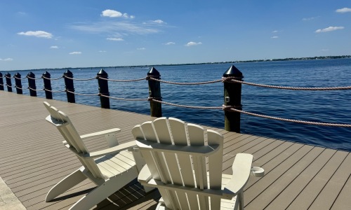 a boardwalk with chairs