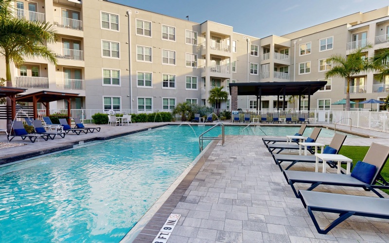 a pool with chairs around it