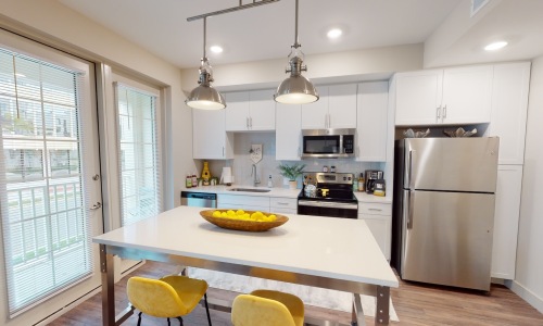 a kitchen with white cabinets