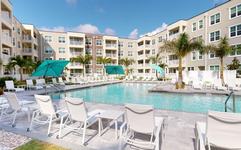 a pool with chairs around it
