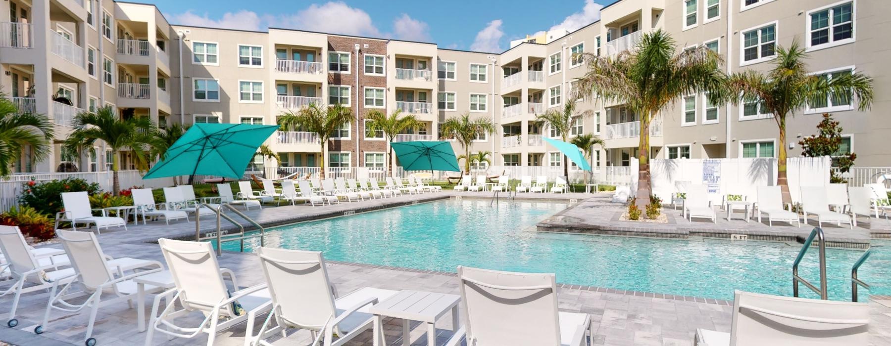 a pool with chairs around it